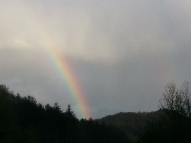 Double Rainbow against hills & trees